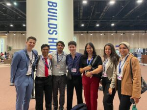 Vinay Karthik with a group of people from COP28